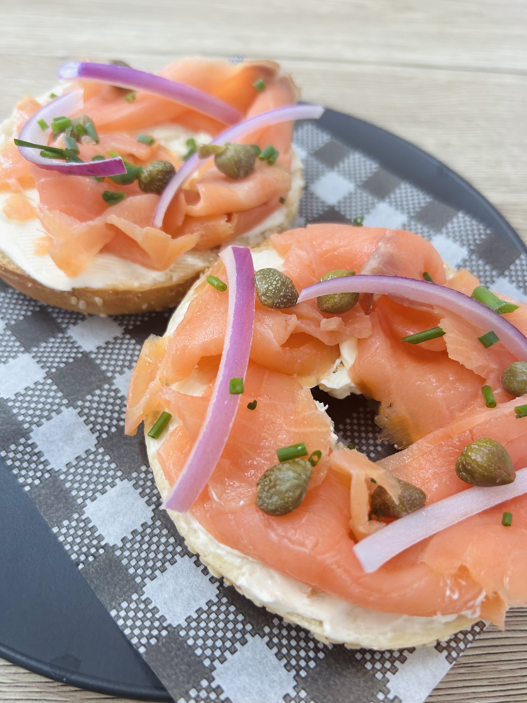 Smoked salmon bagels with cream cheese, capers, red onion and chives