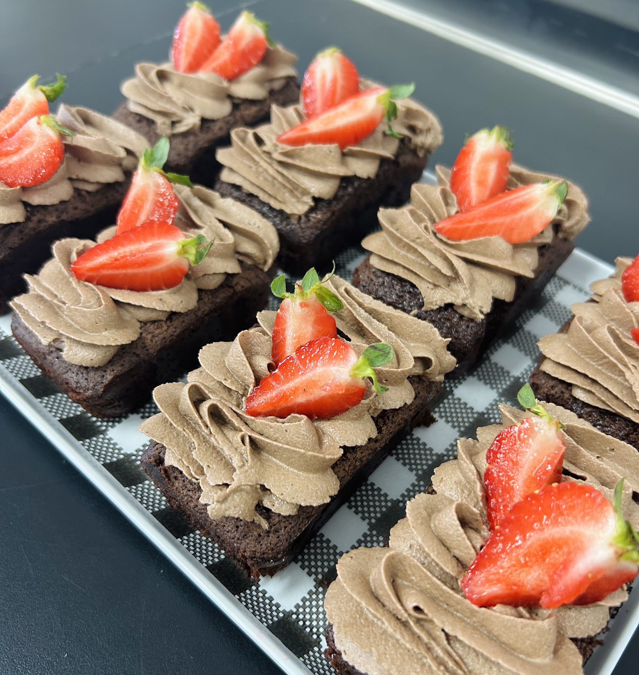 Chocolate brownies with chocolate buttercream and fresh strawberries